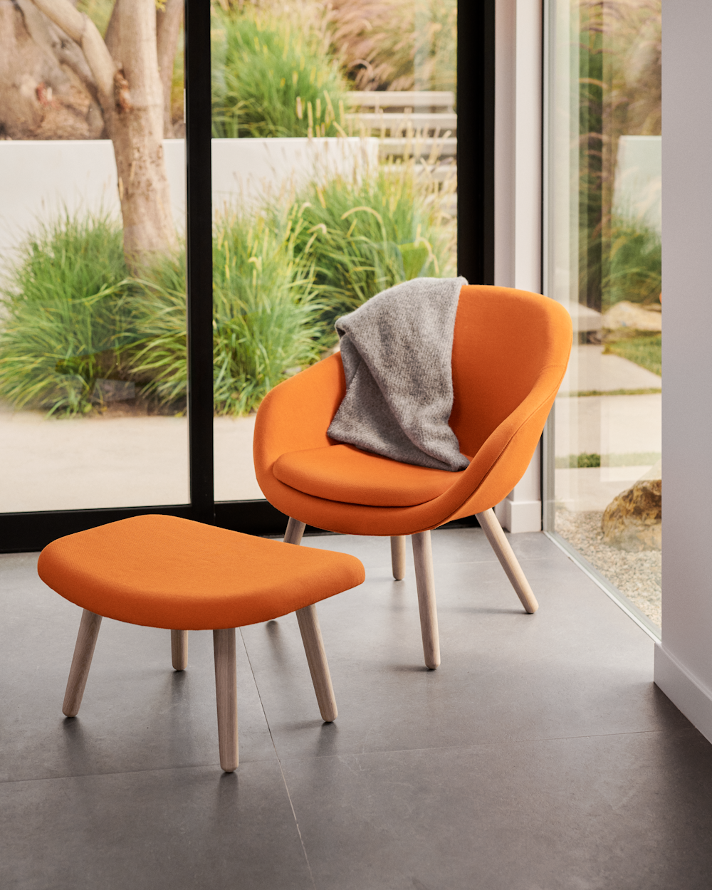 About A Lounge 82 Armchair in a sunroom setting