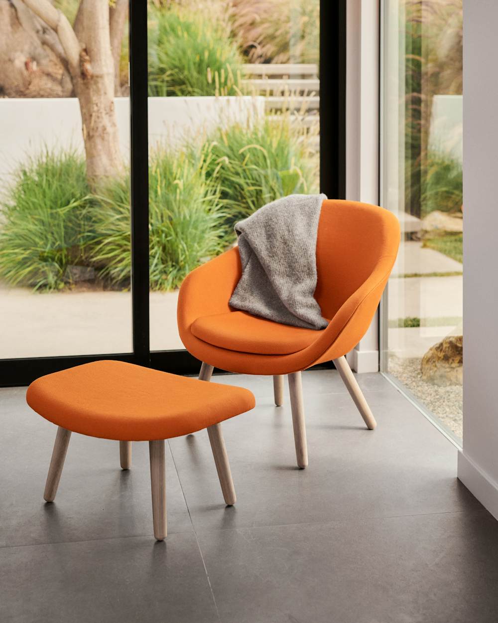 About A Lounge 82 Armchair in a sunroom setting