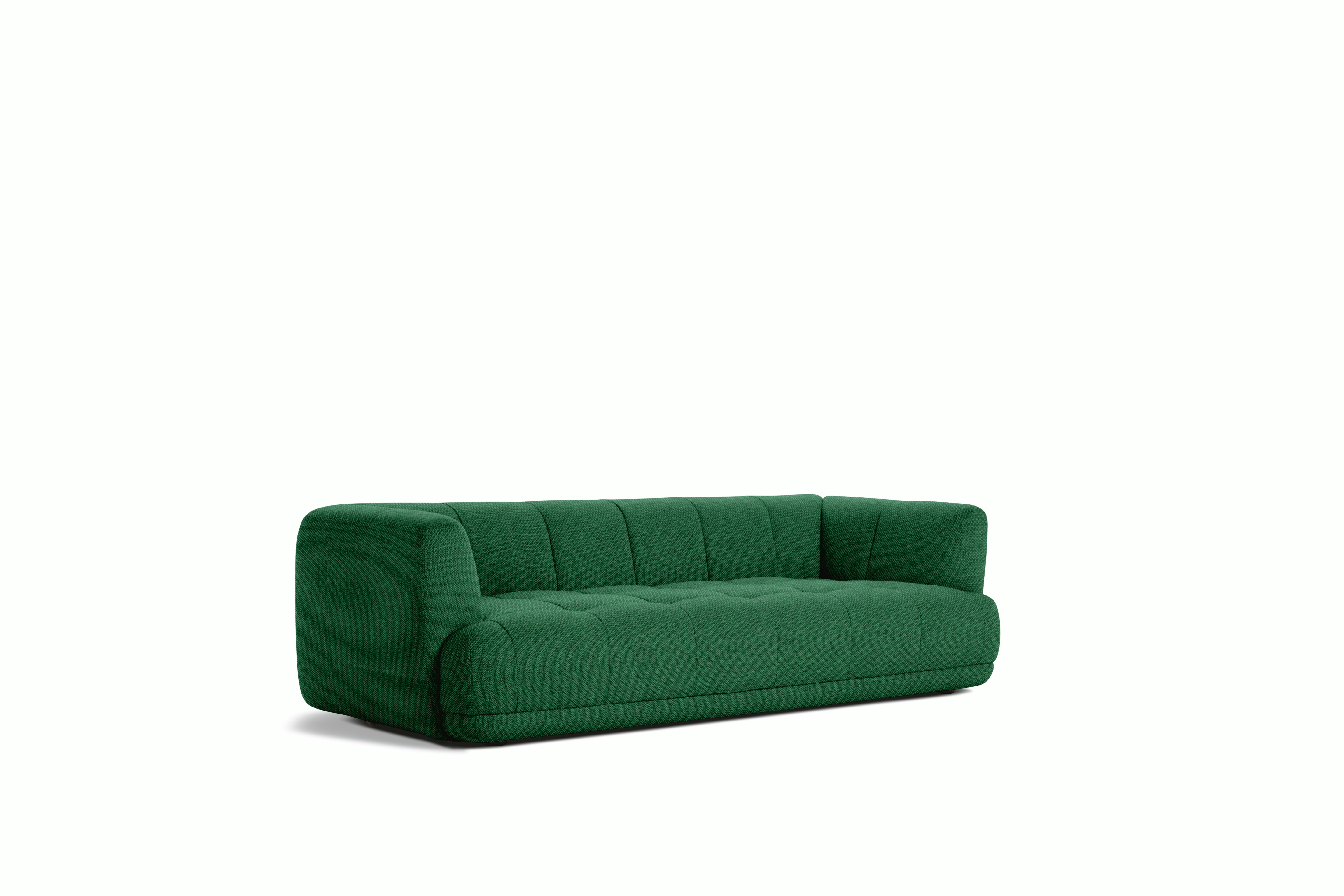 A front angle view of an emerald Quilton Sofa.