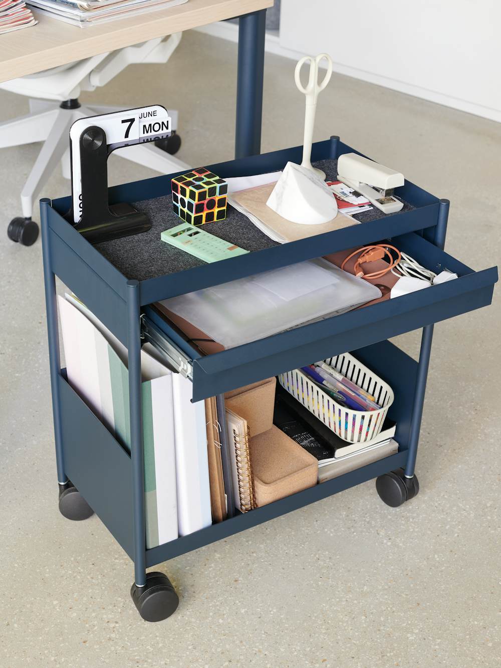 Blue OE1 Storage Trolley with casters in home office setting.