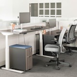 Knoll Tone height-adjustable table with fully-painted white base and Remix ergonomic chair