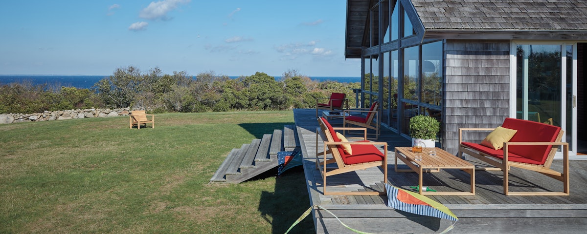 Block Island Outdoor Furniture Set on house exterior deck setting overlooking lawn and ocean