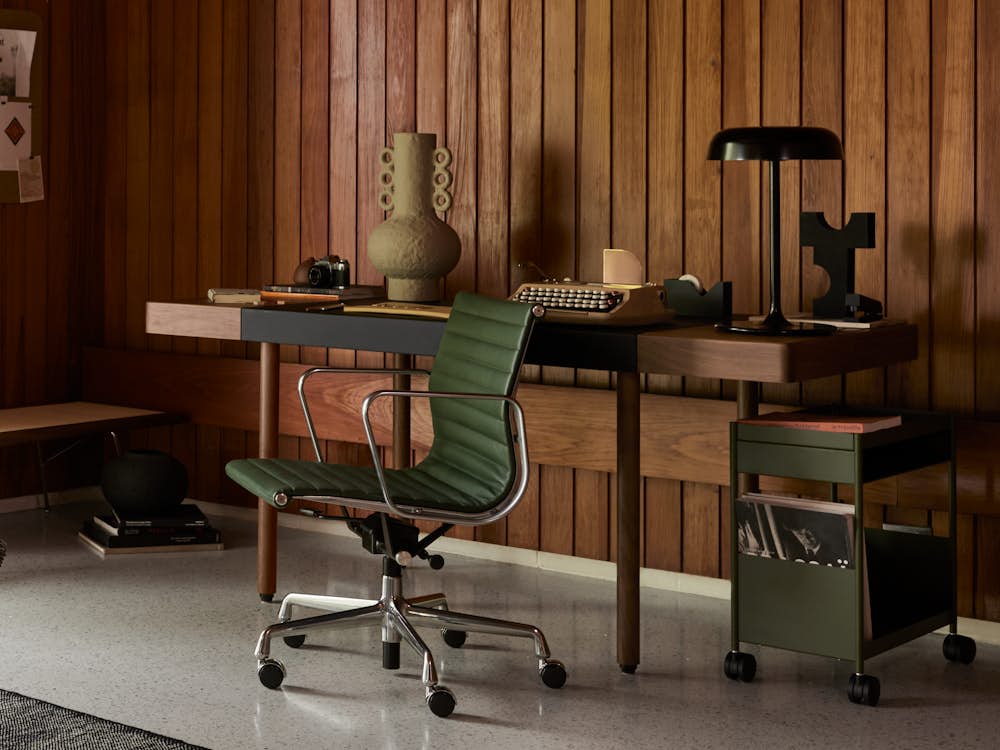 Leatherwrap Sit-to-Stand Desk,  Maharam Argali Rug,  Ode Desk Lamp,  Eames Lounge Chair and Ottoman,  Eames Aluminum Group Chair