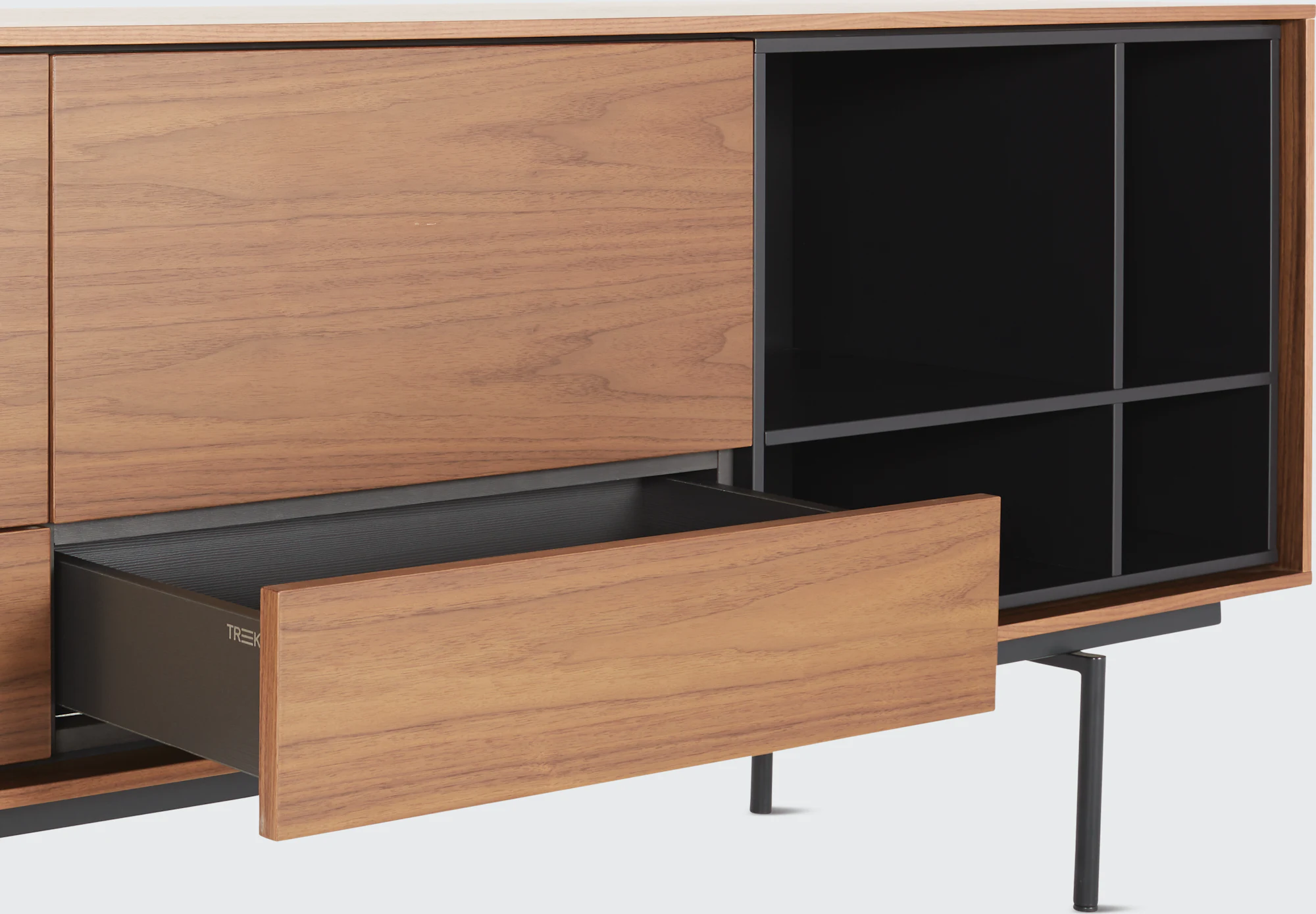 Aura credenza with large oak drawer front extended over dark interior