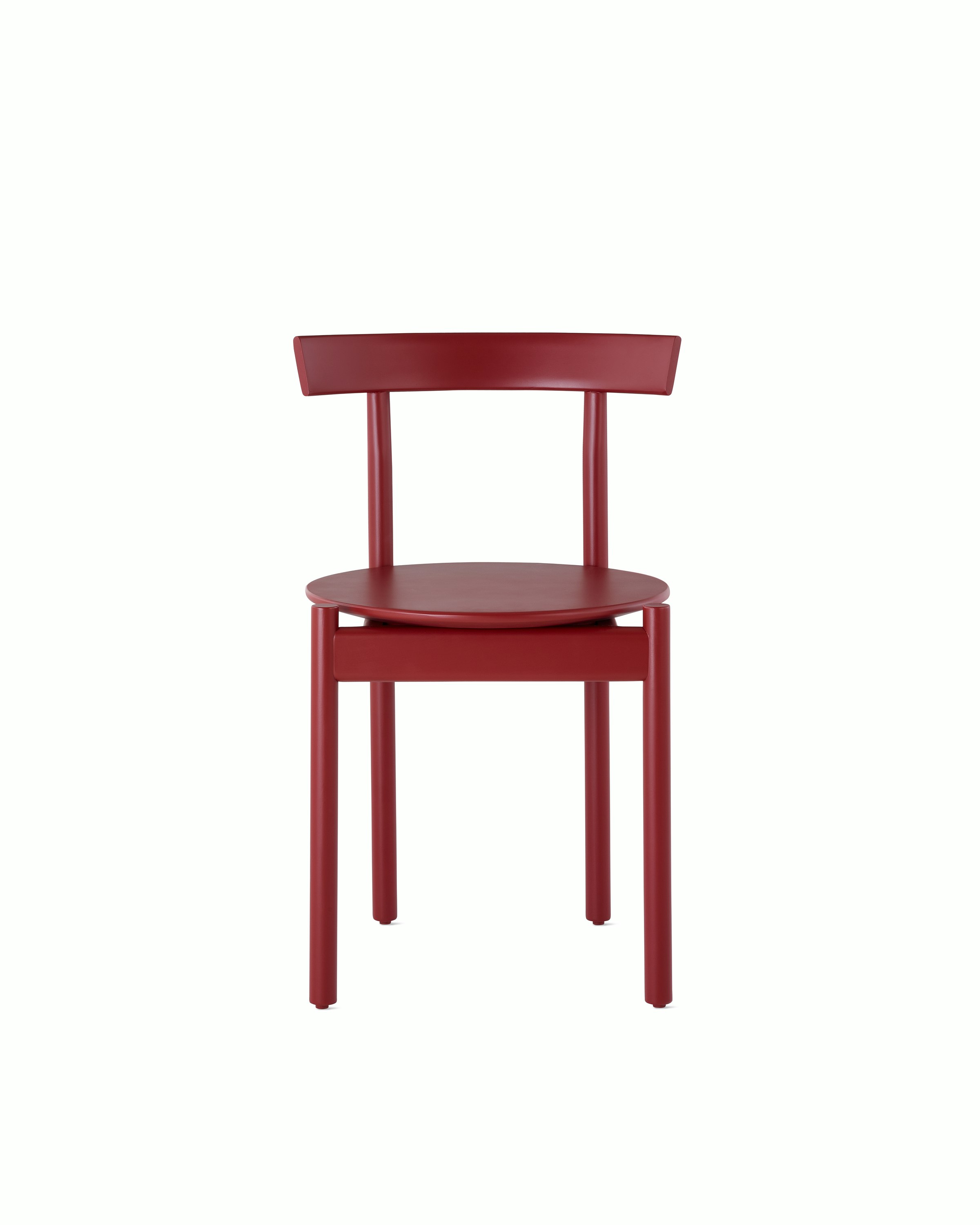 A red Comma Chair, viewed from the front.