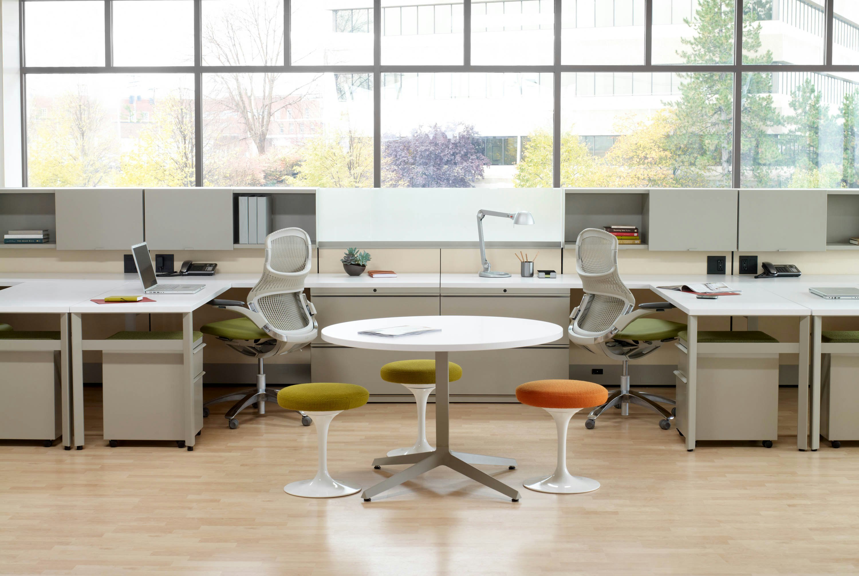 Dividends Skyline workstations with shared overhead storage and Generation chairs