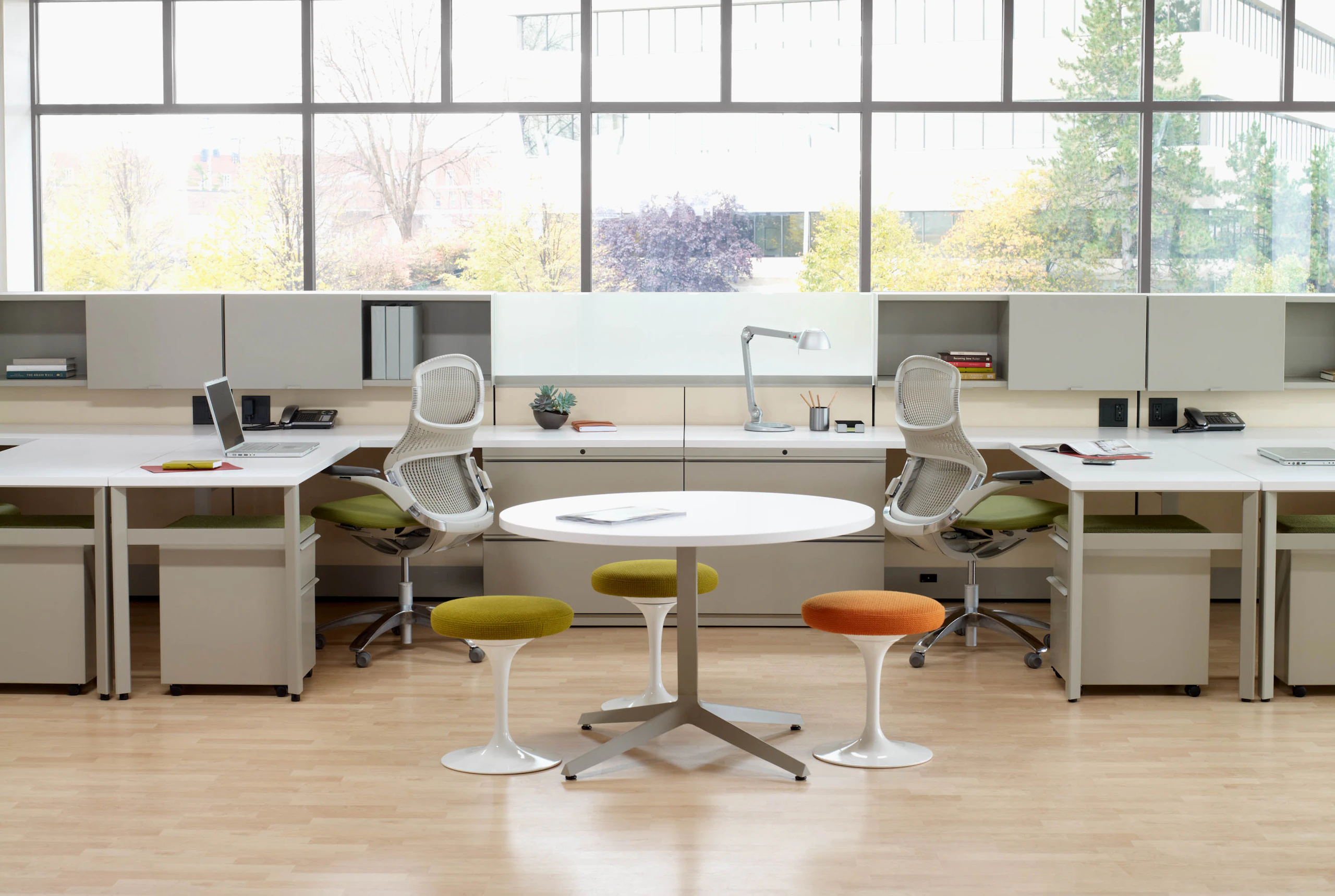 Dividends Skyline workstations with shared overhead storage and Generation chairs
