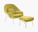 A chartreuse Womb Chair & Ottoman viewed from an angle