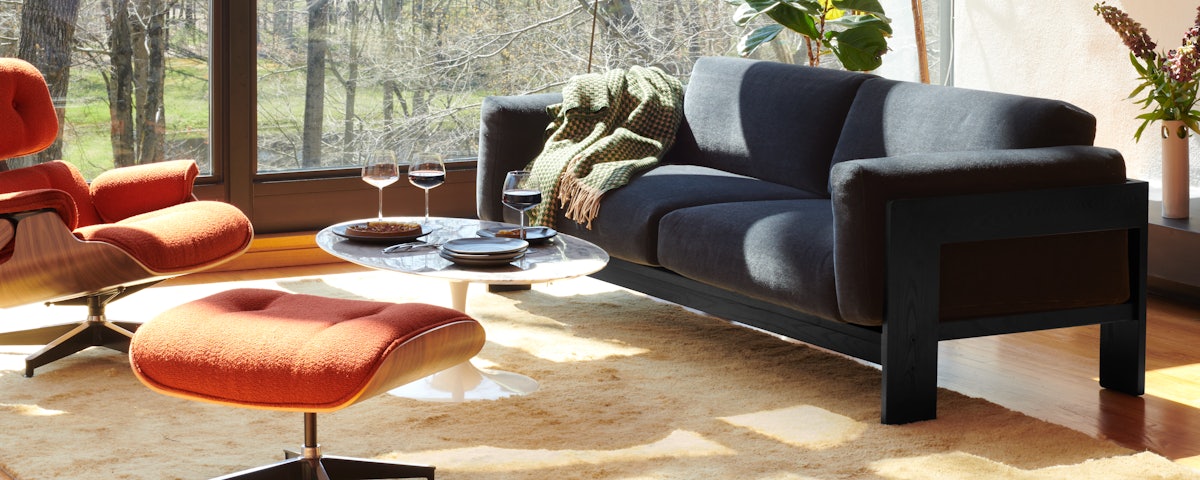 Bastiano Sofa, Saarinen Coffee Table, Ruti Moroccan Wool Rug, Serge Mouille Floor Lamp, Eames Lounge Chair and Ottoman