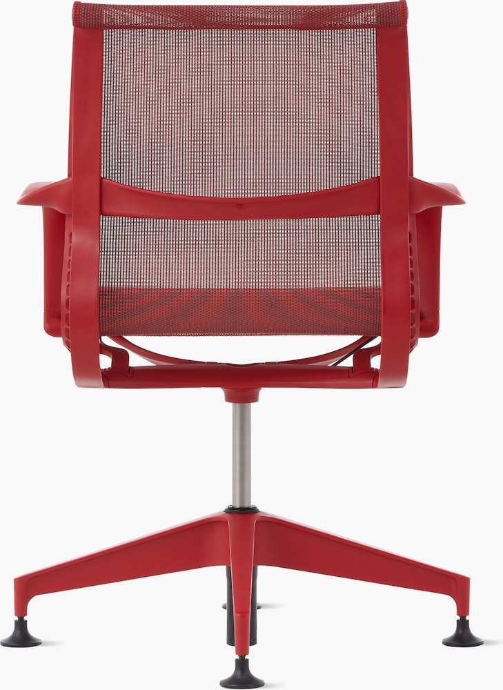 Rear view of a Setu side chair with fixed arms in red.