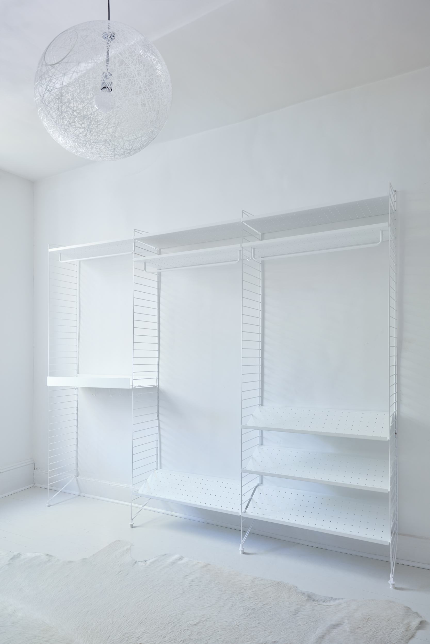 Floor to ceiling modular shoe shelves with decorative trim