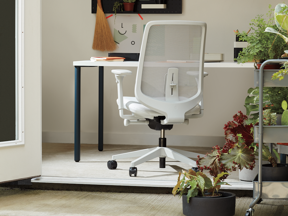 White Verus Chair with blue and white OE1 Rectangular Table in a home office setting.