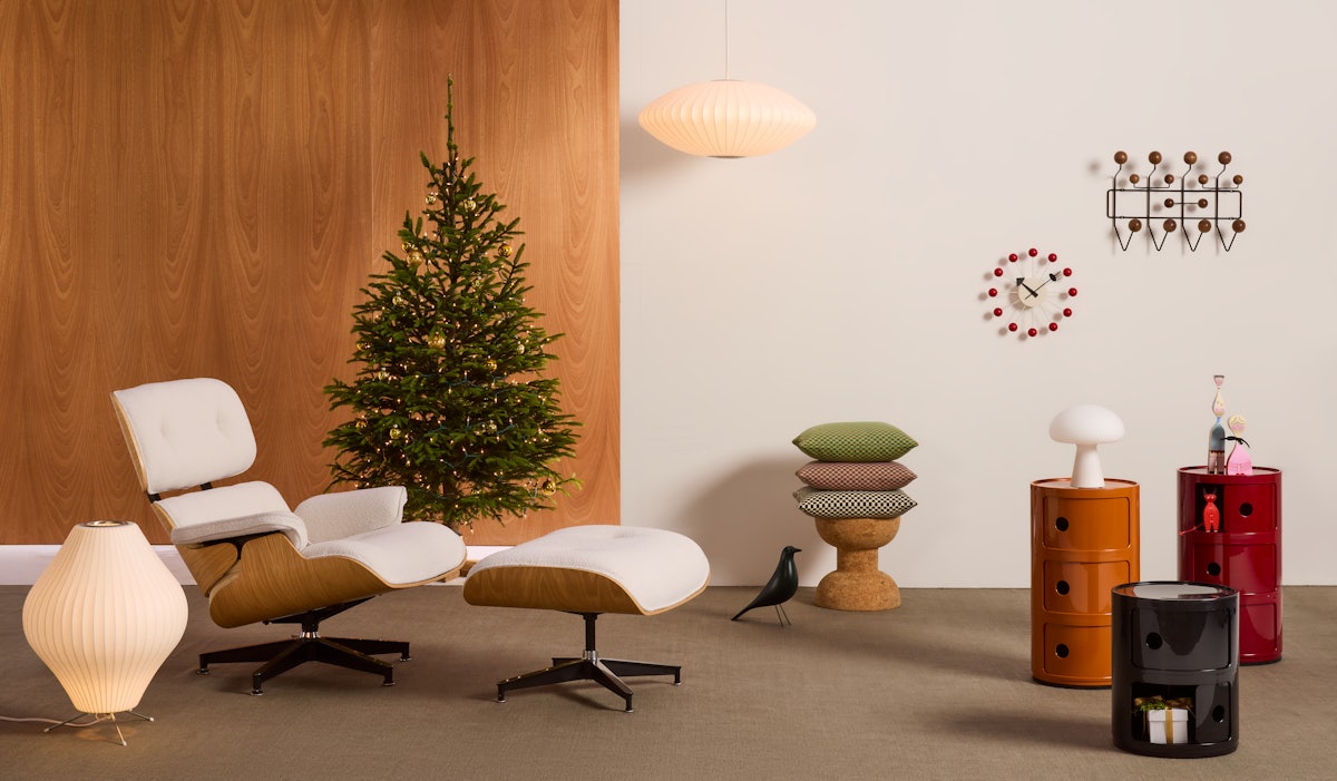 Eames Lounge Chair and Ottoman, Nelson Bubble Lamp and Componibili Storage Unit surrounded by holiday decorations