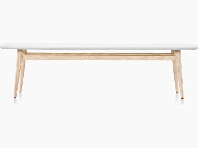 Palisade Occasional Table with wood legs and solid surface top on white sweep.