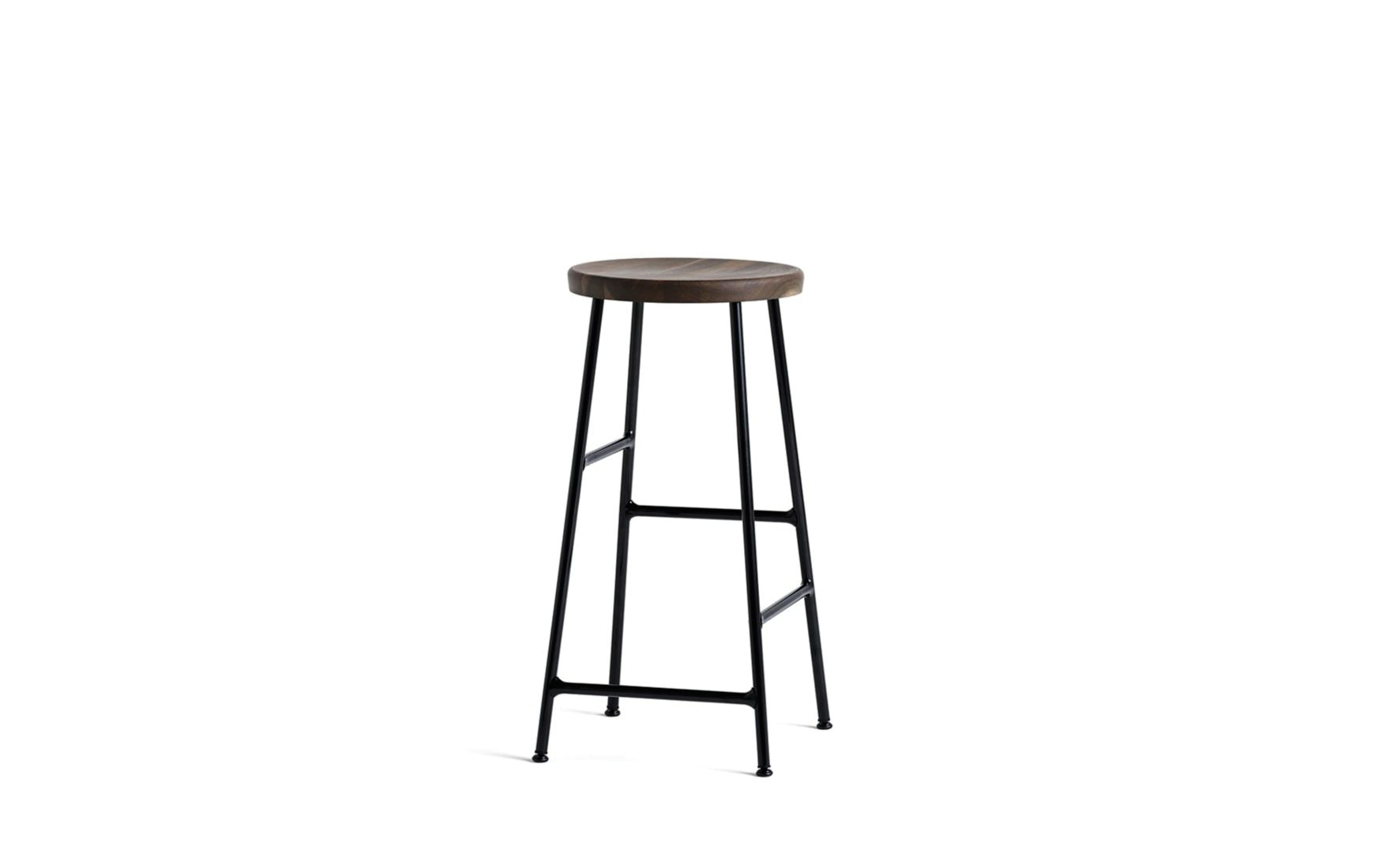A Cornet Counter Stool with a smoked oak seat and black base.