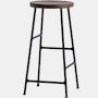 A Cornet Counter Stool with a smoked oak seat and black base.