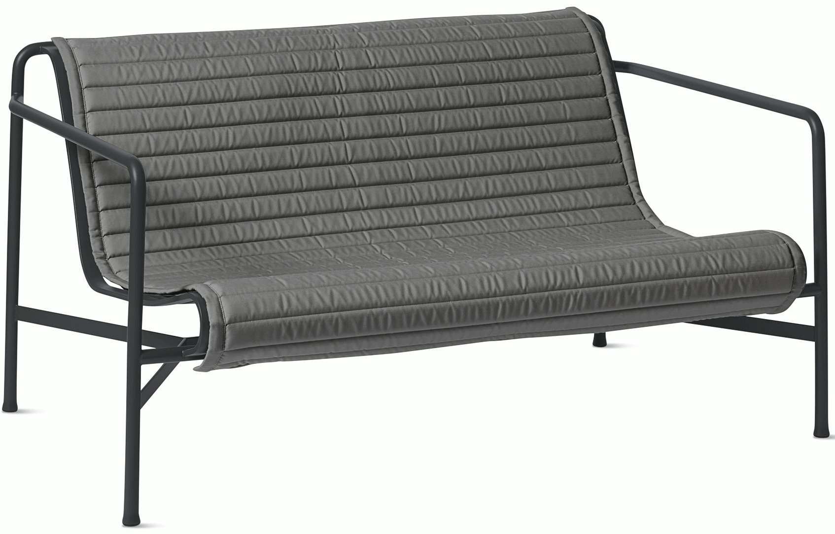 A three quarter view of a Palissade Lounge Sofa with Quilted Cushion in dark grey.