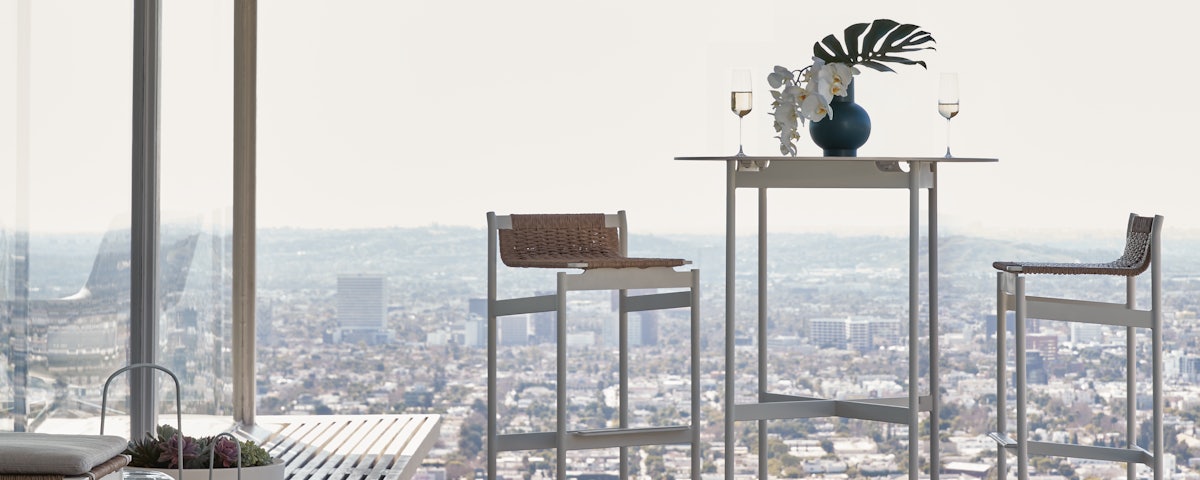 Sommer Barstools and Sommer Side Table in an outdoor patio setting