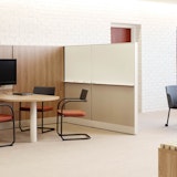 Dividends Horizon Media Enclave laminate fronts wood grain laminate marker board panels beltway power round café table column leg x-base credenza storage
